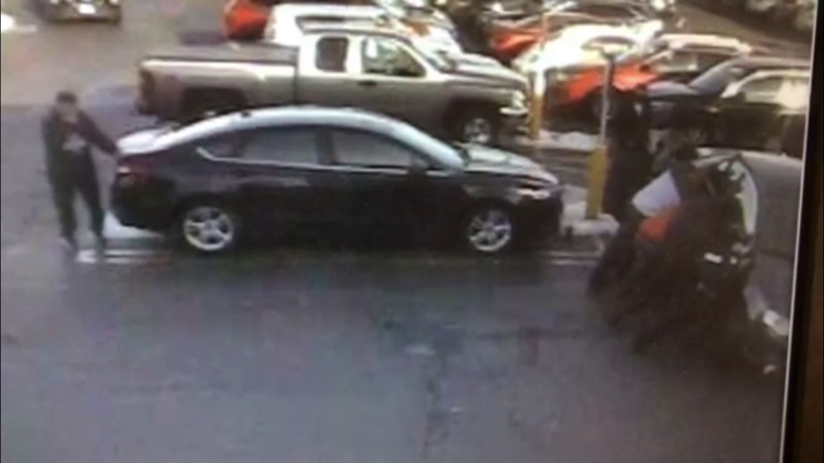 Surveillance video shows group lifting car off woman in Quincy