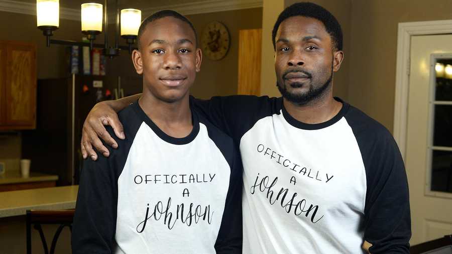 Charles Johnson, right, adopted his former Vincent Middle School student Kenny on Friday. Johnson was inspired to become a foster parent after his parents started fostering.