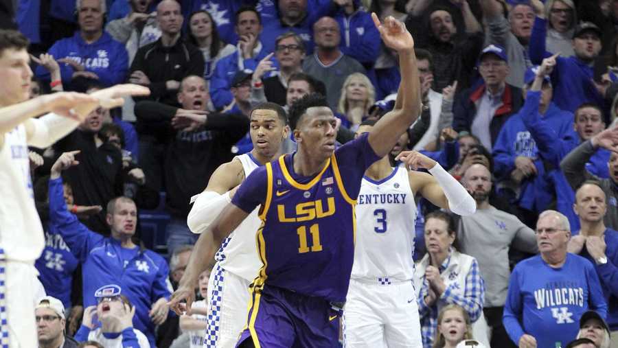 LSU's Kavell Bigby-Williams (11) celebrates after tipping in the game winning shot against Kentucky after an NCAA college basketball game in Lexington, Ky., Tuesday, Feb. 12, 2019. LSU won 73-71. (AP Photo/James Crisp)