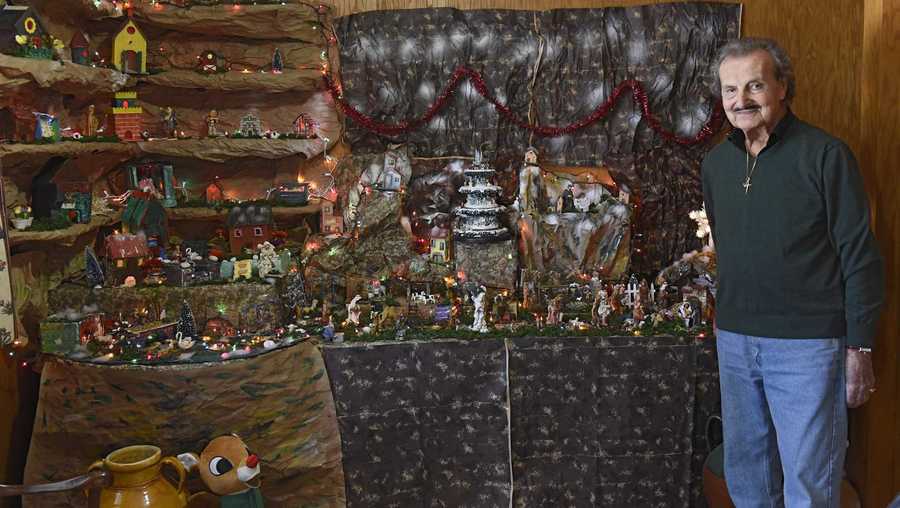 Oswaldo Riccio stands next to a large nativity scene in his home he built to honor his deceased wife Pupa on Friday, Dec. 20, 2019 in Albany, N.Y.