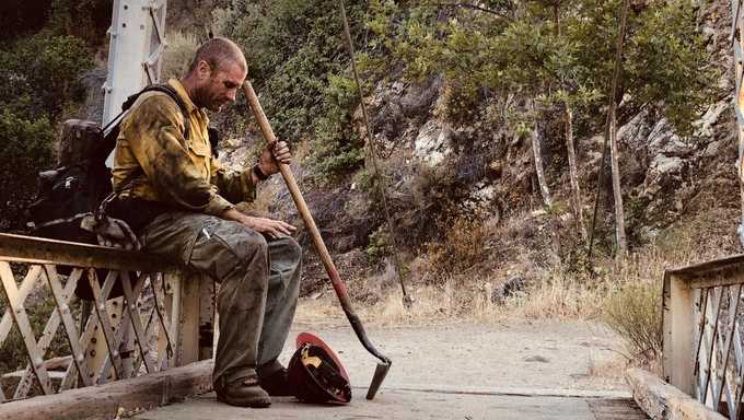 justin grunewald, a u.s. forest service hotshot captain of mill creek's crew 4, pauses for a moment after more than a week of battling flames in the willow fire near big sur, june 2021.