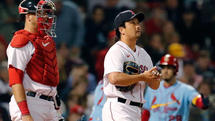 Boston Red Sox's Hirokazu Sawamura, front right, reacts in front of Kevin Plawecki, left, after giving up a two-run single to St. Louis Cardinals' Paul Goldschmidt during the sixth inning of a baseball game, Saturday, June 18, 2022, in Boston.