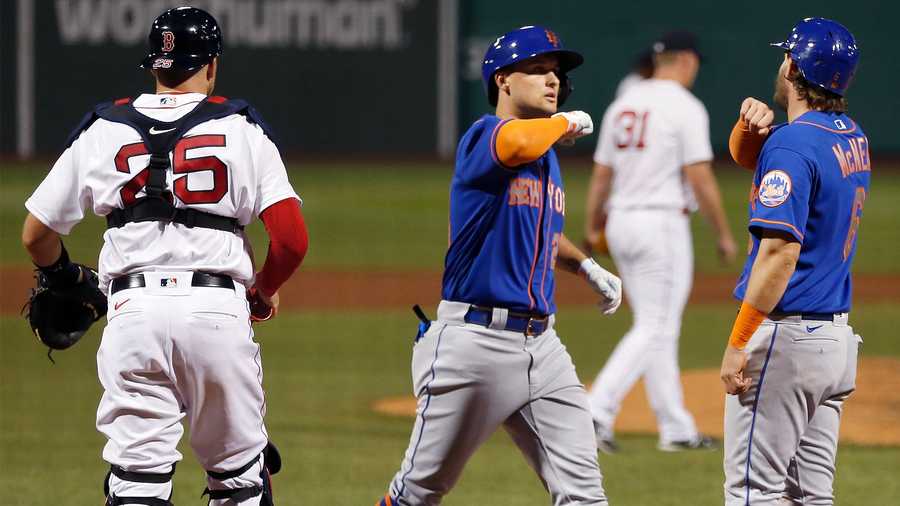 New York Mets' J.D. Davis (28) celebrates his two-run home run off Boston Red Sox's Austin Brice (31) that also drove in Jeff McNeil (6) during the fifth inning of a baseball game, Tuesday, July 28, 2020, in Boston. (AP Photo/Michael Dwyer)