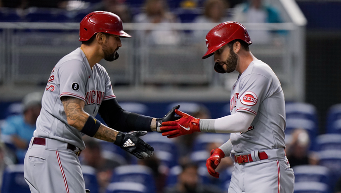 cincinnati reds' nick castellanos, left, congratulates tyler naquin after naquin hit a home run during the first inning of a baseball game against the miami marlins, friday, aug. 27, 2021, in miami. (ap photo/wilfredo lee)