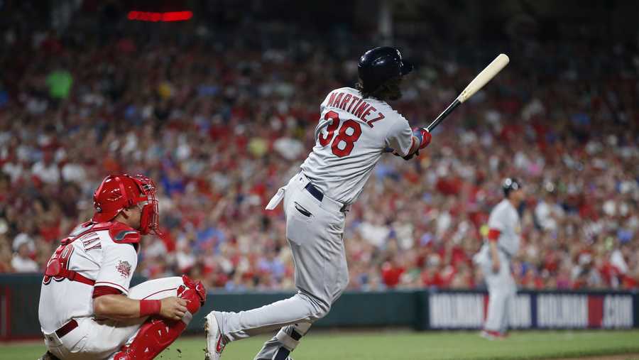 Martinez, Cards score 10 runs in 6th, rally past Reds 12-11