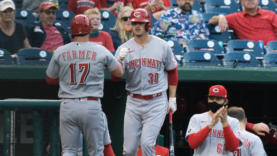 cincinnati reds' kyle farmer (17) is congratulated by tyler mahle (30) after hitting a home run during the third inning of the team's baseball game against the washington nationals in washington, tuesday, may 25, 2021. (ap photo/manuel balce ceneta)