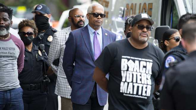 Rep.&#x20;Hank&#x20;Johnson,&#x20;D-Ga.,&#x20;center,&#x20;and&#x20;Cliff&#x20;Albright,&#x20;right,&#x20;co-founder&#x20;of&#x20;Black&#x20;Voters&#x20;Matter,&#x20;are&#x20;arrested&#x20;with&#x20;activists&#x20;during&#x20;a&#x20;protest&#x20;to&#x20;support&#x20;voting&#x20;rights&#x20;outside&#x20;of&#x20;Hart&#x20;Building&#x20;on&#x20;Thursday,&#x20;July&#x20;22,&#x20;2021.