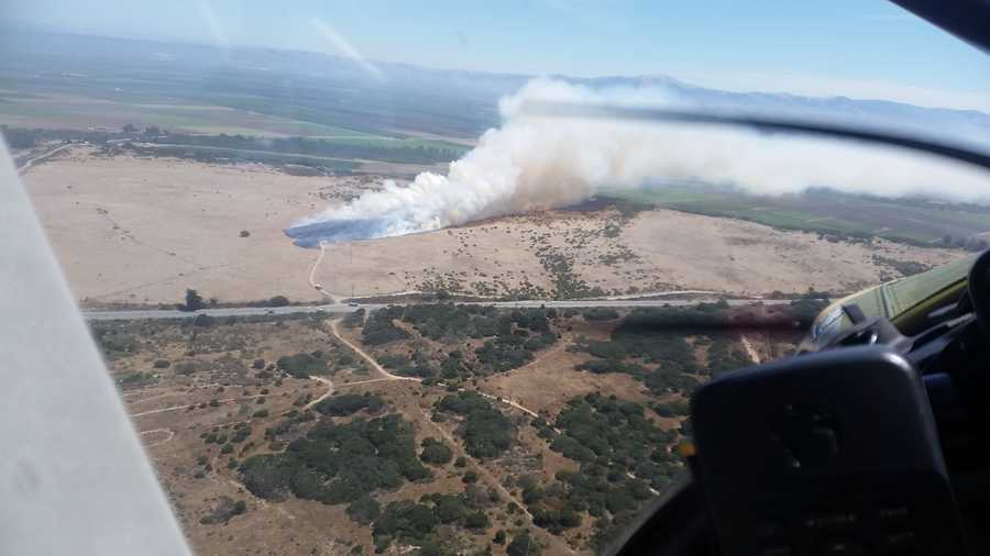 Firefighters battle 100 acre wildfire across from Marina Airport