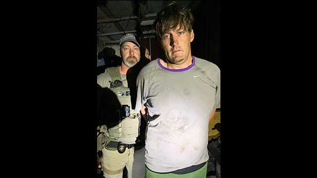 Richard Willis with Community Corrections Associate Director Marc McClure, who also is commander of the Mississippi Department of Corrections’ Special Response Team, immediately after Willis’ capture in Pope late Monday night.