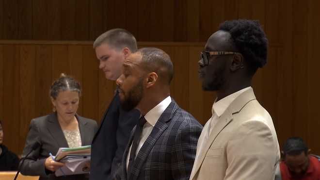 Rida Kori (far right) in court for a pre-trial hearing on Thursday, ﻿Oct. 3, 2024.﻿