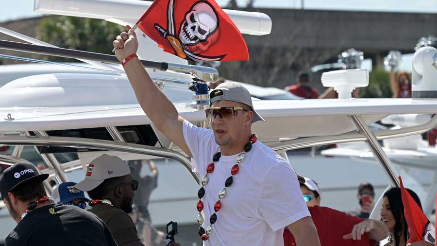 In this file photo, Tampa Bay Buccaneers tight end Rob Gronkowski, center, arrives for a celebration of their Super Bowl 55 victory over the Kansas City Chiefs with a boat parade, Wednesday, Feb. 10, 2021, in Tampa, Fla. (AP Photo)