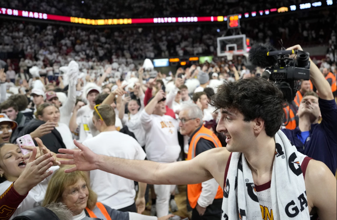 Iowa&#x20;State&#x20;forward&#x20;Milan&#x20;Momcilovic&#x20;celebrates&#x20;a&#x20;79-75&#x20;win&#x20;over&#x20;Kansas&#x20;as&#x20;fans&#x20;storm&#x20;the&#x20;court&#x20;Saturday,&#x20;Jan.&#x20;27,&#x20;2024,&#x20;in&#x20;Ames.
