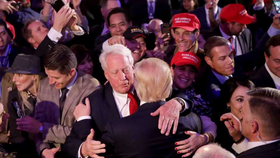 Republican president-elect Donald Trump hugs his brother Robert Trump after delivering his acceptance speech at the New York Hilton Midtown in the early morning hours of November 9, 2016 in New York City.