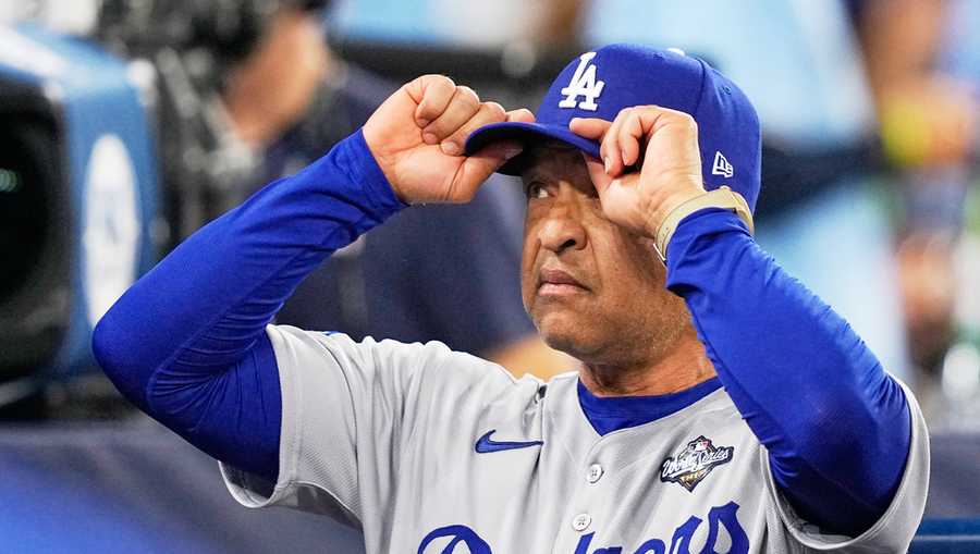 Los Angeles Dodgers manager Dave Roberts watches before Game 7 of baseball&apos;s World Series against the Toronto Blue Jays