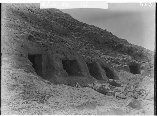 This photo provided by researchers shows rock-cut tombs in Nuwayrat, Egypt where a pottery vessel in which the remains of a man, radiocarbon dated to around 2855–2570 cal BCE, was discovered.