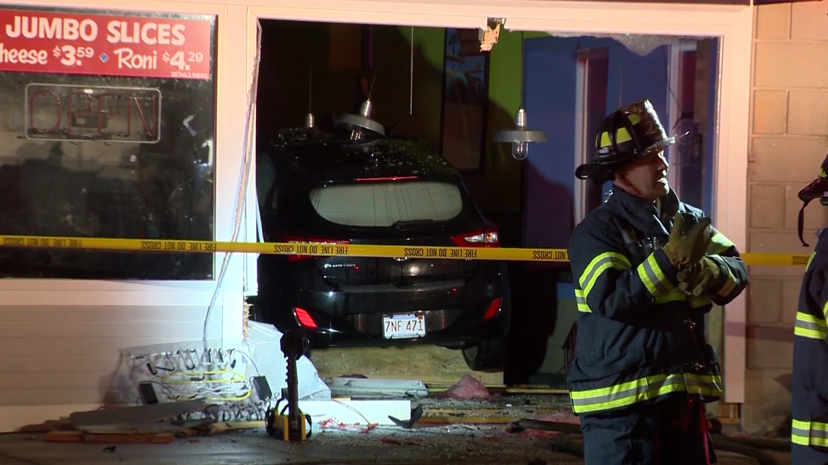 Car plows into restaurant, apartments evacuated