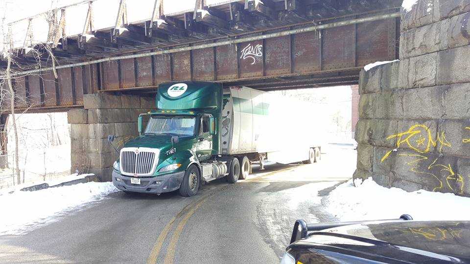Tractortrailer gets stuck under railroad bridge in Rollinsford