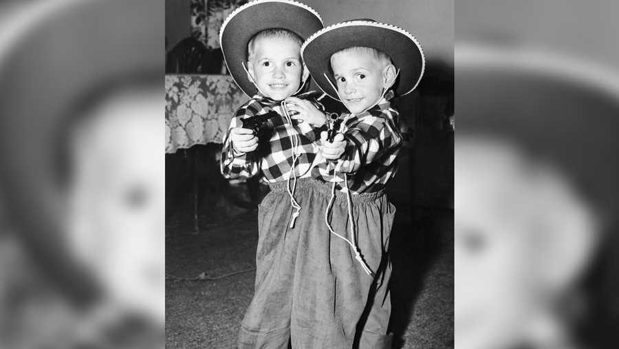 Ronnie and Donnie Galyon pose in their cowboy suits on their third birthday in Dayton. The children were joined at the waist.