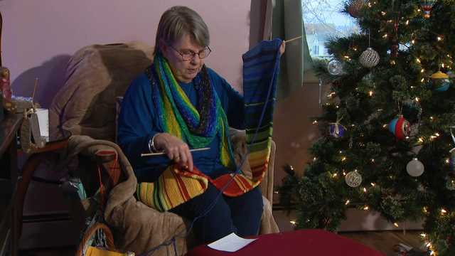 Maryland woman knits scarf with each color tracking 2025's daily temperatures