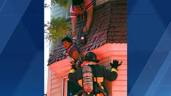 Woman, child rescued by firefighters from burning Boston home