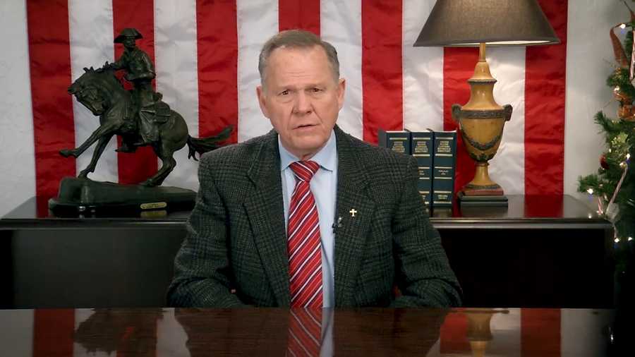 Roy Moore sitting at a desk