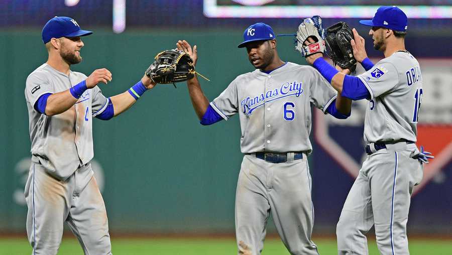 Kansas City Royals,' Alex Gordon, left, Lorenzo Cain and Paulo Orlando celebrate after they defeated the Cleveland Indians in a baseball game, Friday, Sept. 15, 2017, in Cleveland. (AP Photo/David Dermer)