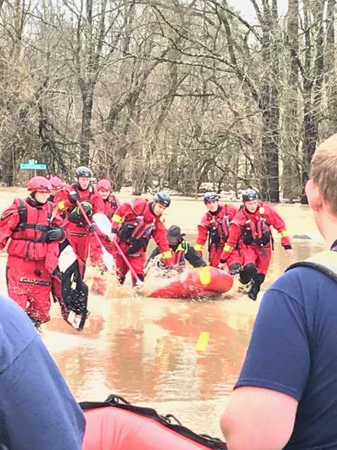 Crews rescue Rumpke dump truck driver who became trapped in high water ...