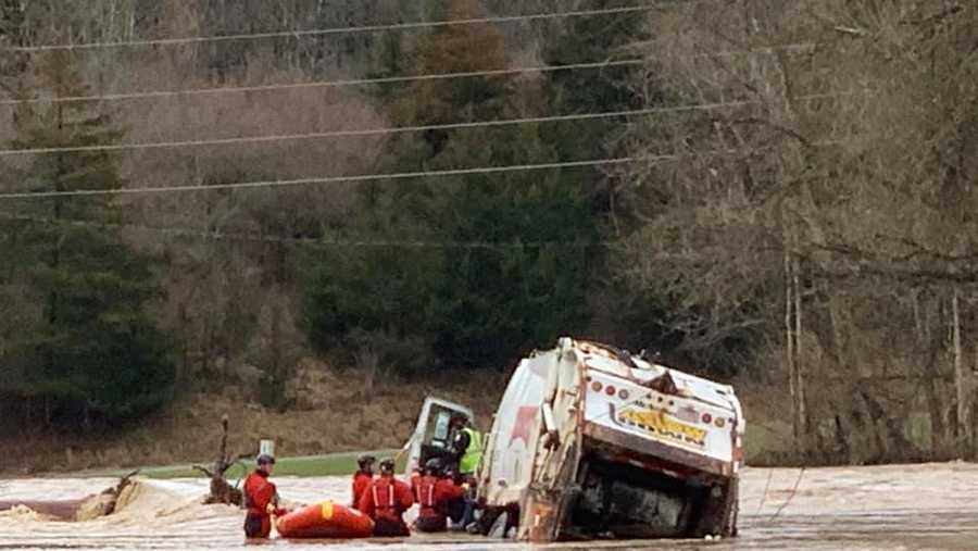 Crews rescue Rumpke dump truck driver who became trapped in high water