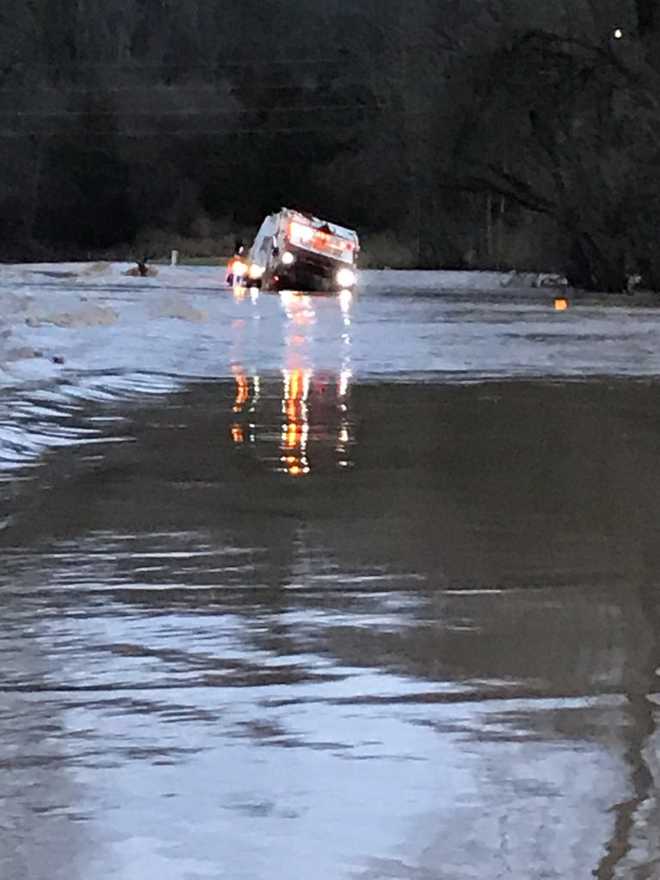 Crews rescue Rumpke dump truck driver who became trapped in high water