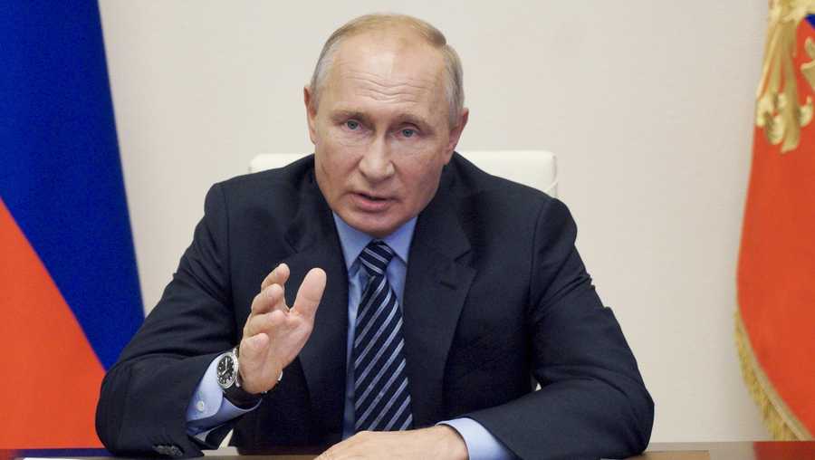 FILE - In this file photo taken on Thursday, July 9, 2020, Russian President Vladimir Putin gestures during a video conference meeting at the Novo-Ogaryovo residence outside Moscow in Moscow, Russia.