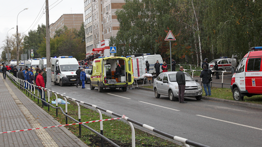 Police and paramedics work at the scene of a shooting at school No. 88 in Izhevsk, Russia, Monday, Sept. 26, 2022.