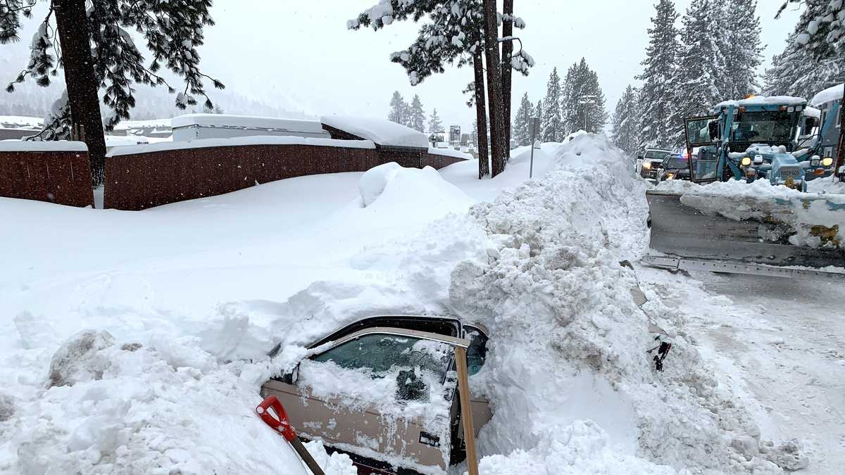 Snowplow driver hits car buried in snow, finds woman alive inside