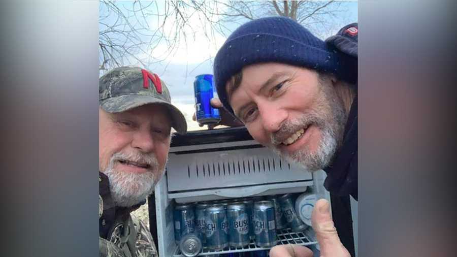 Kyle Simpson and Gayland Stouffer take a selfie with their beer discovery.
