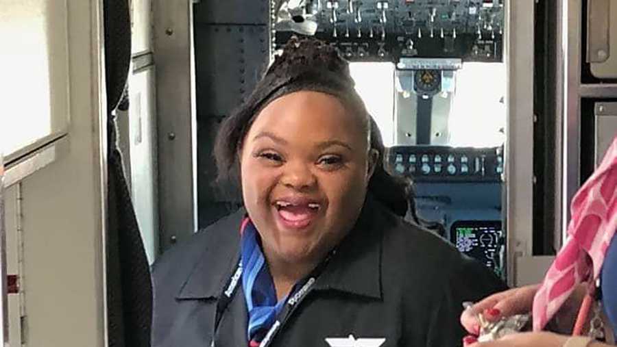Shantell "Princess" Pooser smiles wide as she became an honorary American Airlines flight attendant.
