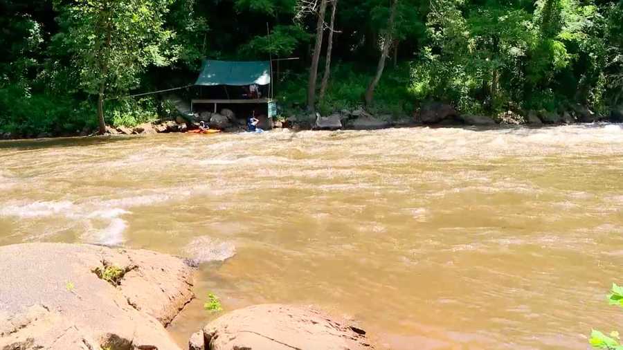 A mother and her young child were rescued after their inner tube capsized in a mountain river.