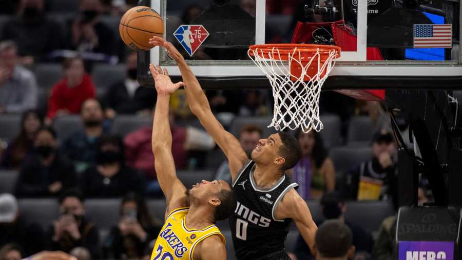 Sacramento Kings guard Tyrese Haliburton (0) blocks the shot of Los Angeles Lakers guard Avery Bradley (20) in the second half of an NBA basketball game in Sacramento, Calif., Wednesday, Jan. 12, 2022. The Kings won 125-116.