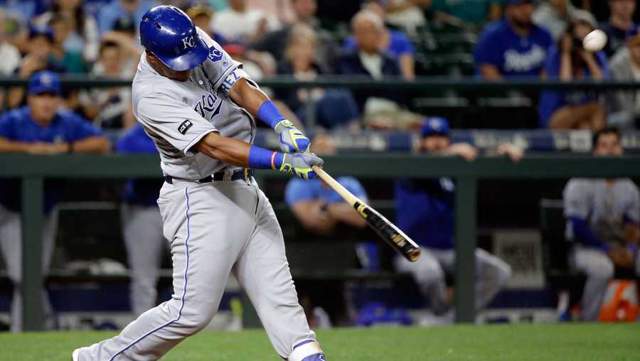 Kansas City Royals' Salvador Perez hits a two-run home run against the Seattle Mariners in the 10th inning of a baseball game Wednesday, July 5, 2017, in Seattle. (AP Photo/Elaine Thompson)