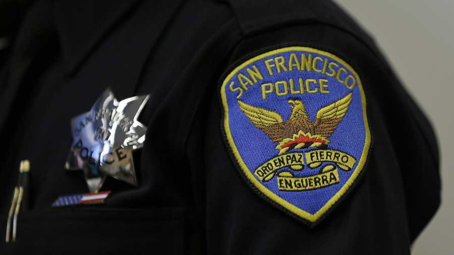 This April 29, 2016, file photo, shows a patch and badge on the uniform of a San Francisco police officer in San Francisco.