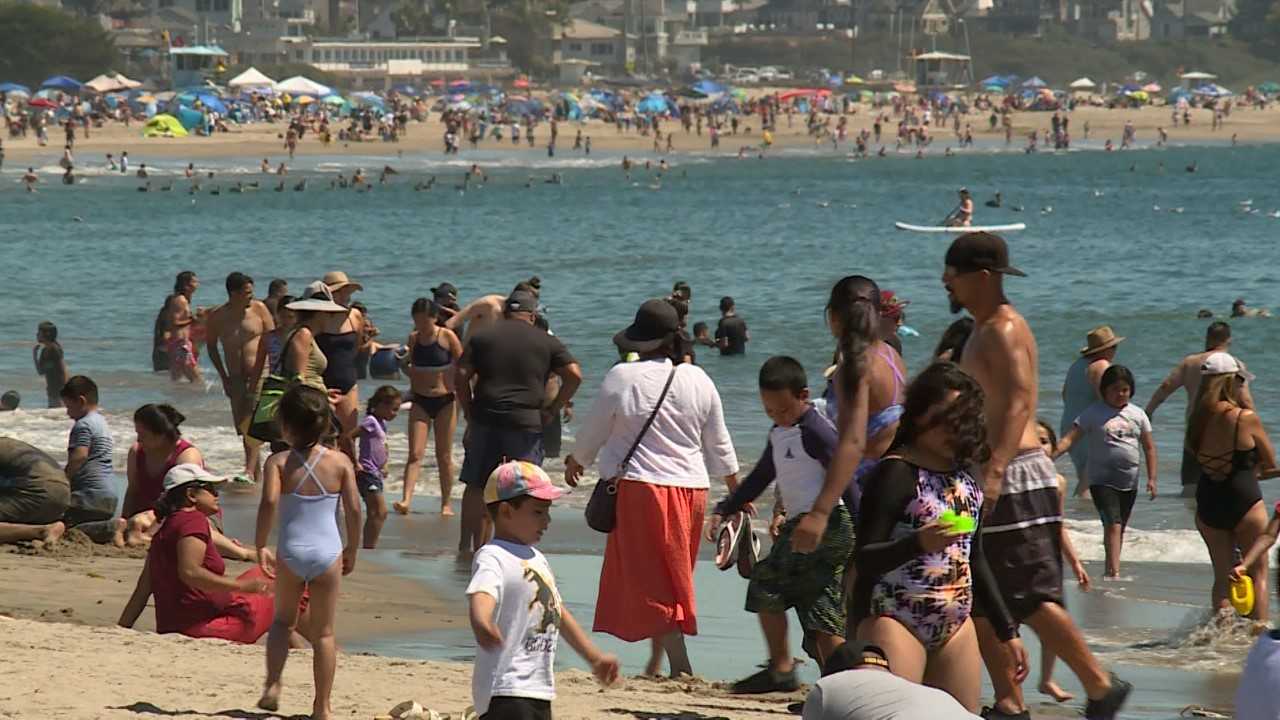 Thousands flock to California beaches to escape the extreme heat