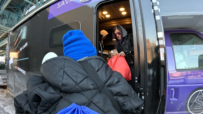 sarah laurel hands out supplies in philadelphia in january.