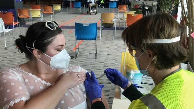 Woman dons wedding reception dress she planned to wear to canceled event to get COVID-19 vaccine - Vimarsana News