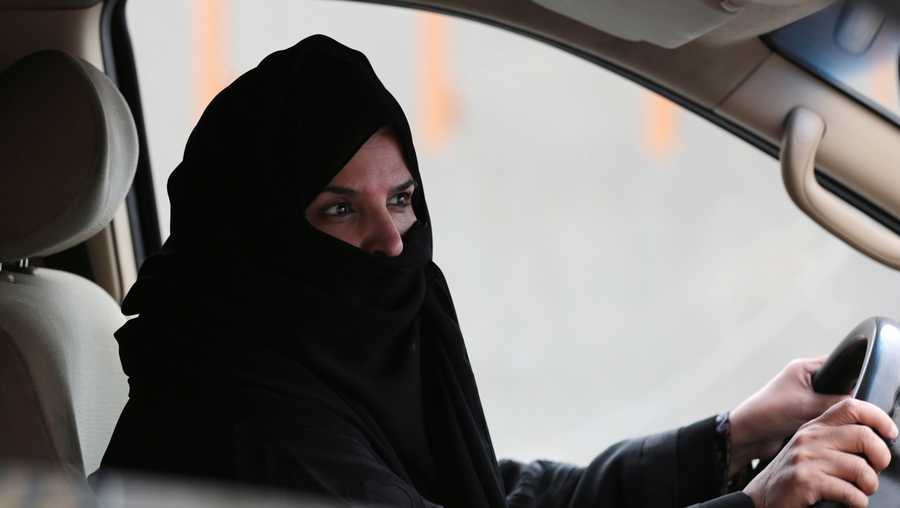 Aziza Yousef drives a car on a highway in Riyadh, Saudi Arabia, Saturday March 29, 2014, as part of a campaign to defy Saudi Arabia's ban on women driving.
