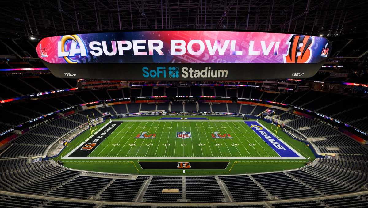 01 February 2022, US, Inglewood: Workers paint the Super Bowl LVI