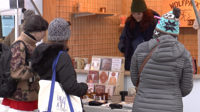 shoppers browse sales on small business saturday