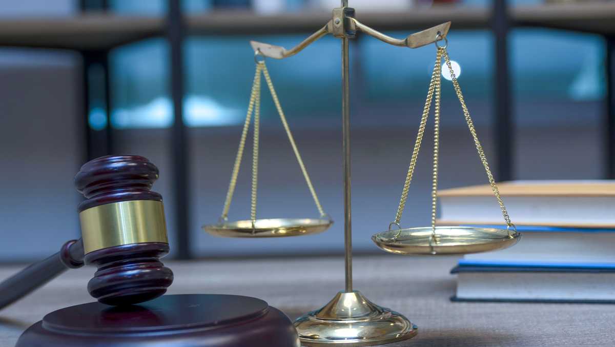 Gavel, scales of justice and law books.