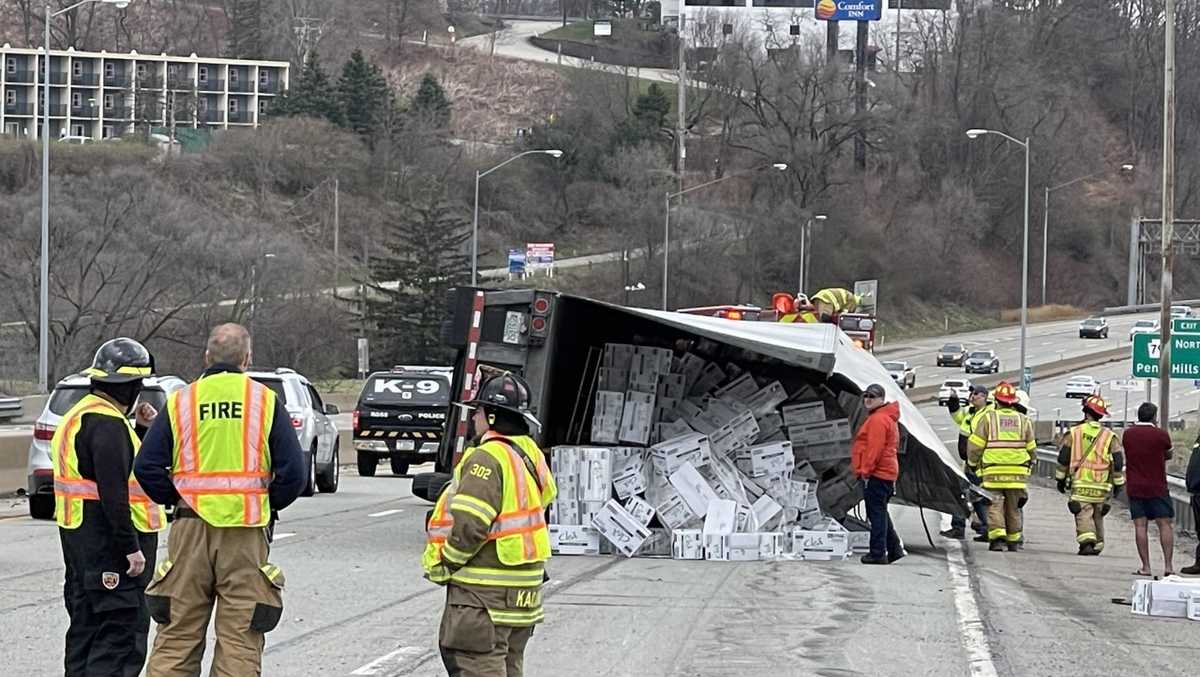 Tractortrailer roll over on Parkway East spill debris, causes traffic delays