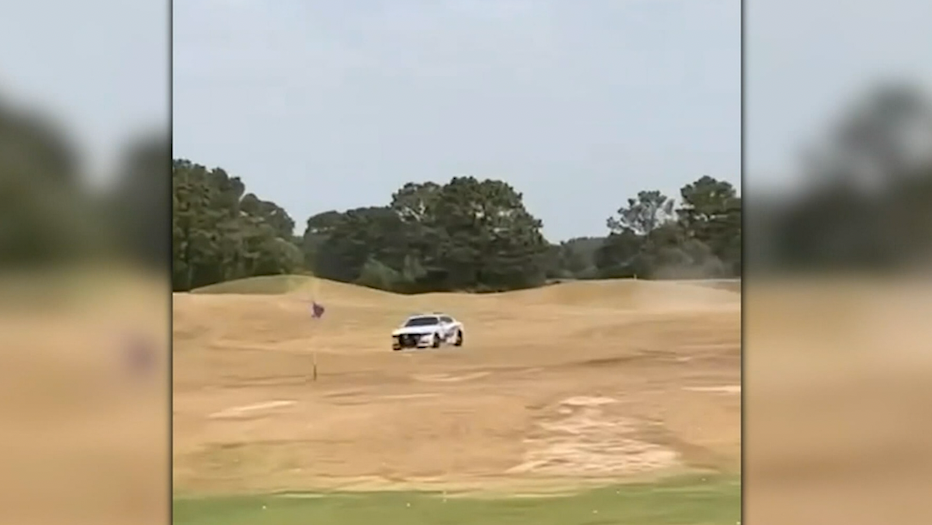 Video: Police chase interrupts golf game