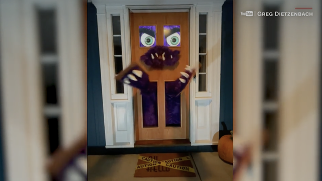 DIY 'Monst-door' comes alive for trick-or-treaters