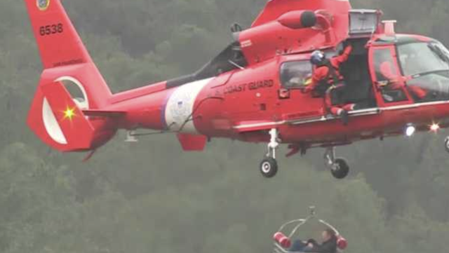 Couple and dog rescued by helicopter as flood waters closed in - Vimarsana News