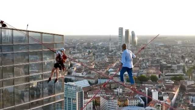 WATCH: Daredevil walks tightrope over bustling city - Vimarsana News